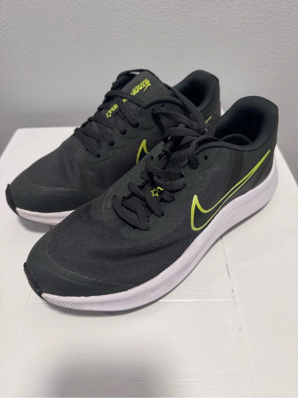 Nike Black Sneakers with Neon Yellow Swoosh and White Sole
